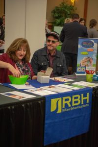 Two people at the RBH table