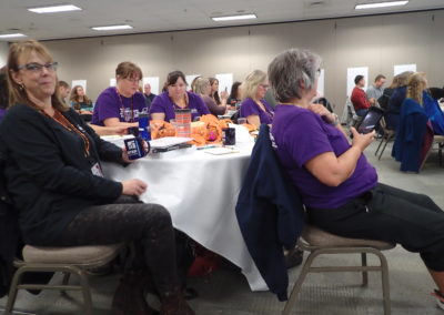 Group of people in purple shirts at the wellness conference