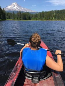Person kayaks on Trilliam Lake with Mt. Hood in the background