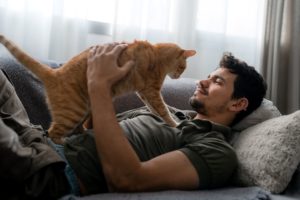 Man relaxing with cat
